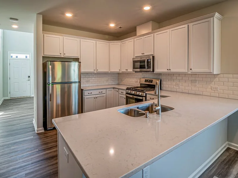 Contemporary kitchen featuring stainless steel appliances and a spacious countertop