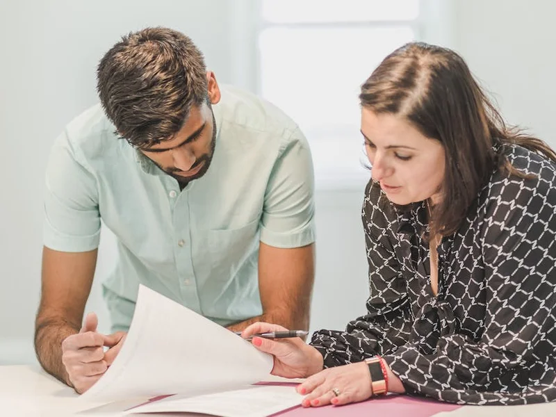 Professional consultation meeting between painter and homeowner