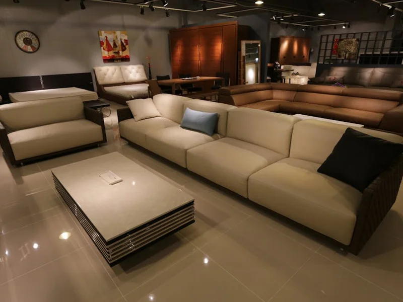 Elegant living room showcasing modern furniture with plush sofas and ambient lighting.